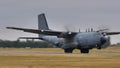 Cold war era military transport airplane takes off