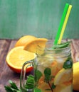 Detox water with lemon and mint. Summer drink in glass jar on rustic wooden background. Diet, healthy eating, weight loss concept. Royalty Free Stock Photo