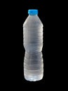 cold water in a plastic bottle with a blue cap on black background Royalty Free Stock Photo