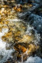 Cold Water Rushes Over Rocks Below