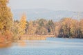 Autumnal view of Rhine valley with Karren mountain in background and flocks of storks