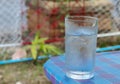 Cold Water on Wood Table. glass of Cool fresh drink with ice Royalty Free Stock Photo