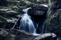 Cold waterfall in the Jizera mountains Czech environment on the border with Poland. A source of drinking water and moisture for Royalty Free Stock Photo