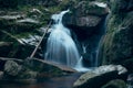 Cold waterfall in the Jizera mountains Czech environment on the border with Poland. A source of drinking water and moisture for Royalty Free Stock Photo