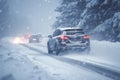 Cold weather challenge car covered in snow navigating icy roads Royalty Free Stock Photo