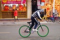 Chinese students riding a bicycle on the street