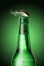 Cold wet beer bottle with frost and vapor Royalty Free Stock Photo