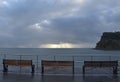 Cold, wet benches at a seaside town Royalty Free Stock Photo