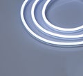 Cold white glowing LED neon flex strip on black dark background Royalty Free Stock Photo