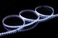 Cold white LED strip tape on black background Royalty Free Stock Photo