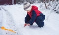 Cold white snow in childrens hands. A little boy plays with the snow Royalty Free Stock Photo