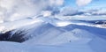 Cold winter day. High mountains with snow white peaks. Wallpaper background. Natural landscape with beautiful sky. Ski resort Royalty Free Stock Photo