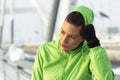 Fit girl resting after exercise on snow Royalty Free Stock Photo