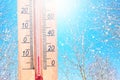 Cold winter weather - 10 degrees Celsius. Thermometer in winter frosty weather in the snow shows low temperatures - minus ten. Low Royalty Free Stock Photo