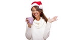 Cold young woman in a Santa hat sipping coffee tea Royalty Free Stock Photo