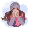 Colds, seasonal flu. A girl with a runny nose in warm clothes, a hat and a scarf