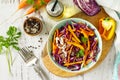 Cabbage salad in a bowl on a wooden table. Top view flat lay background