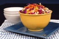 Cole slaw with carrot in a yel