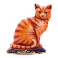 Colered antique figurine of a cat. Royalty Free Stock Photo
