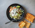 Coleslaw with vegetables, tomatoes and cucumbers with sauces and toasts for a light breakfast Royalty Free Stock Photo