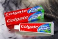 Colgate triple action toothpaste isolated on metal background. Royalty Free Stock Photo