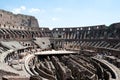 The Coliseum on the inside, Roman architecture with stones. Ancient and historical monument in Europe. On a sunny day with blue sk Royalty Free Stock Photo