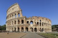 Coliseum on a sunny day in Rome, Italy, with a small group of tourists Royalty Free Stock Photo