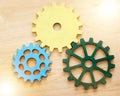 Collaboration, engineering and construction concept with industrial gears, mechanics and cogs on a table or desk in an Royalty Free Stock Photo