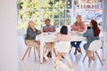Collaboration, food and team building with a business woman group sitting around a table for eating. Meeting Royalty Free Stock Photo