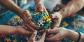 A collaboration of hands to hold a sphere comprised of multicolored puzzle pieces, teamwork and unity in the business Royalty Free Stock Photo