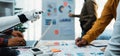 Collaboration Between Human and Robot in Modern Office Setting with Data Visualization and Technology Integration for Royalty Free Stock Photo