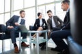 Corporate business team meeting in a modern open plan office Royalty Free Stock Photo