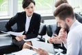 Corporate business team meeting in a modern open plan office Royalty Free Stock Photo