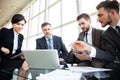 Corporate business team meeting in a modern open plan office Royalty Free Stock Photo