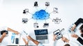 Collaborative Cloud Computing Session with Data Analysis and Digital Interface Visualizations in Modern Office Setting Royalty Free Stock Photo