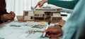 Collaborative Architecture Design Session with Scale Model and Blueprints on Table SACTR Royalty Free Stock Photo