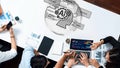 Collaborative Meeting on Artificial Intelligence Strategy and Data Visualization with Notebooks, Laptops, and Graphs on Royalty Free Stock Photo