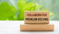 Collaborative Problem Solving text on wooden block with blurred nature background. Teamwork and collaboration concept Royalty Free Stock Photo