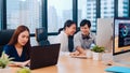 Collaborative process group of multicultural business people in smart casual wear communicating and using technology while working Royalty Free Stock Photo