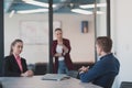 Collaborative process of multicultural skilled young business team during brainstorming meeting in office.Diverse group Royalty Free Stock Photo