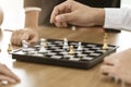 Collaborative process of skilled person brainstorming play chess game in office