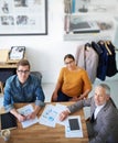 Collaborative skills are crucial in this business. Portrait of creative businesspeople having a meeting around a table. Royalty Free Stock Photo