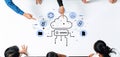 Collaborative Team Discussing Cloud Computing Solutions with Visual Data Flow Diagram and Digital Icons Representing Royalty Free Stock Photo