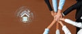 Collaborative Teamwork for Smart Home Technology Advancement with Diverse Hands Overlaid on Digital Home Network Icon Royalty Free Stock Photo