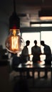 Collaborative workspace with warm glow from light bulb, encouraging creativity and productivity