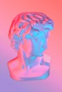 Collage with antique sculpture of human face in neon style. Modern creative concept image with ancient statue head David