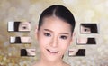 Collage of Asian Woman make up hair style, plastic surgery, graphic face splitting difference visual style. Studio lighting gold Royalty Free Stock Photo
