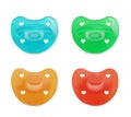 Collage of baby pacifiers in different colors on white background