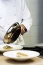 Collage of Chef cooking pan fried cod in kitchen Royalty Free Stock Photo