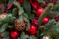 Collage of Christmas toys, spruce branches, berries and cones. Close-up Royalty Free Stock Photo